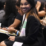 Black graduate smiling